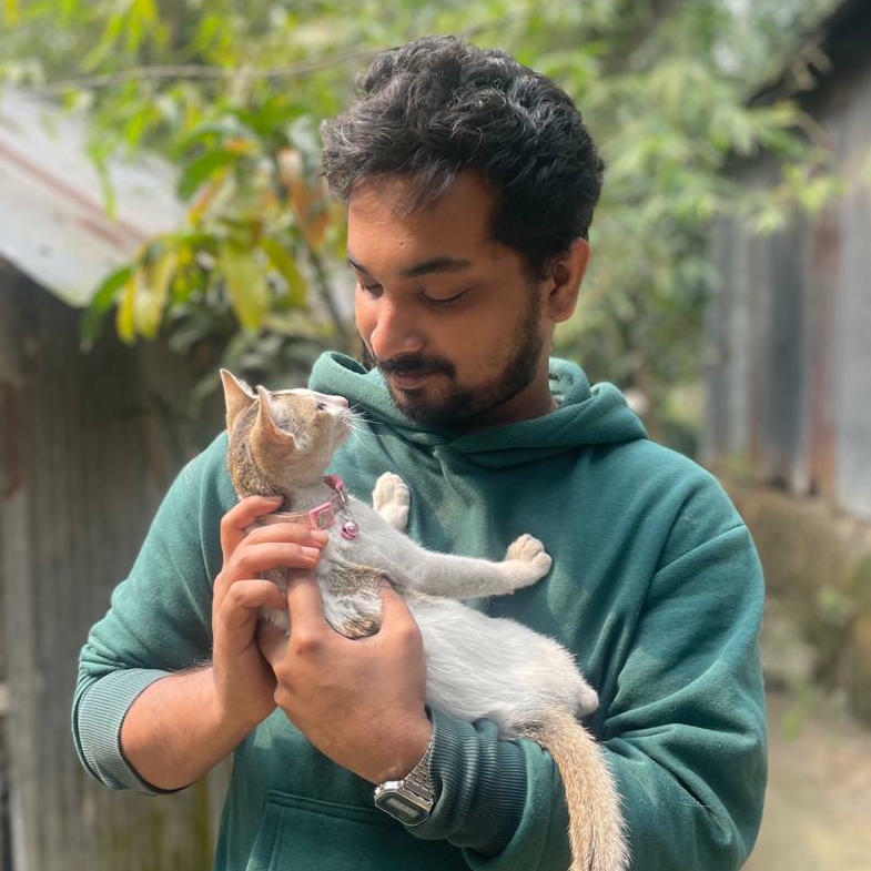 Mohammad Akash with a cat